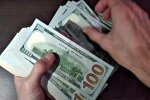 Долари США. Фото: скріншот Youtube-відео