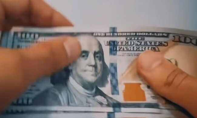 Доллары. Фото: скриншот YouTube-видео