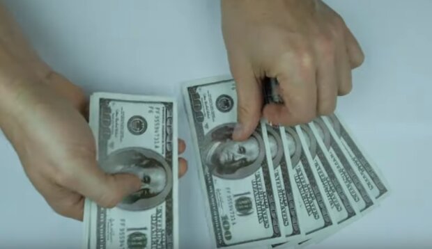 Доллары. Фото: скрин youtube