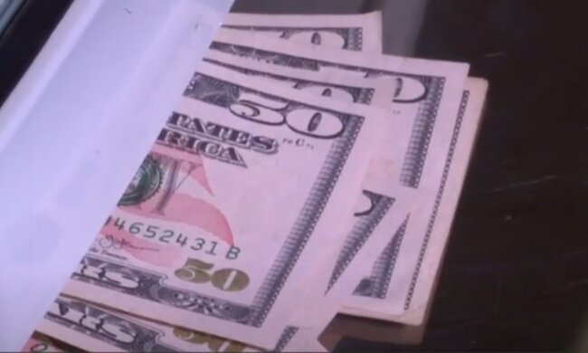 Доллары. Фото: скриншот YouTube-видео