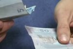 Деньги. Фото: скриншот YouTube-видео