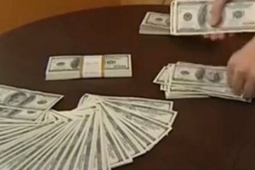 Доллары. Фото: скриншот YouTube-видео