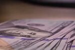 Доллары. Фото: скриншот YouTube-видео