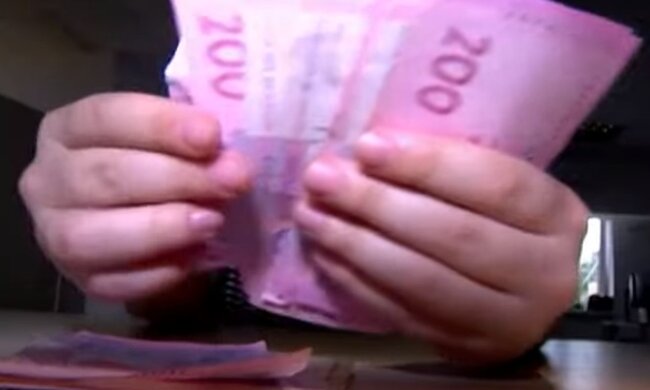 Деньги. Фото: скриншот YouTube-видео