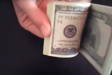Доллары. Фото: скриншот YouTube-видео