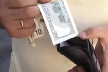 Доллары. Фото: скриншот YouTube-видео