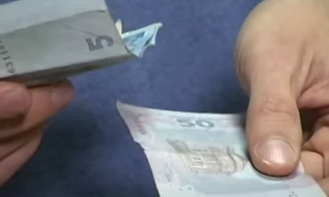 Деньги. Фото: скриншот YouTube-видео