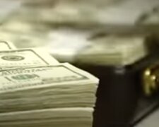 Доллары. Фото: скриншот YouTube