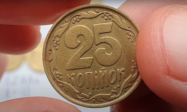 Монета. Фото: YouTube, скрін