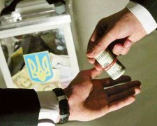 Пачки денег. В Украине массовый подкуп избирателей в пользу кандидата П.
