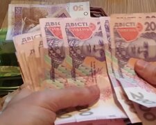 Деньги.  Фото: скриншот YouTube-видео