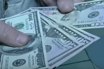 Доллары. Фото: скриншот YouTube