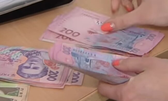 Деньги.  Фото: скриншот YouTube-видео