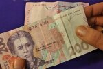 Деньги. Фото: скриншот YouTube-видео