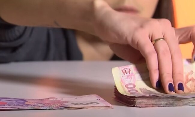 Деньги. Фото: скриншот YouTube-видео