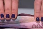 Деньги. Фото: скриншот YouTube-видео