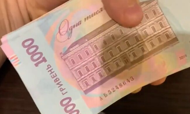 Деньги.  Фото: скриншот YouTube-видео