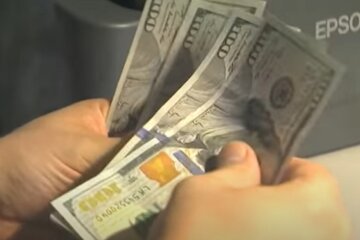 Доллары. Фото: скриншот YouTube-видео