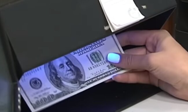 Доллары. Фото: скриншот YouTube-видео
