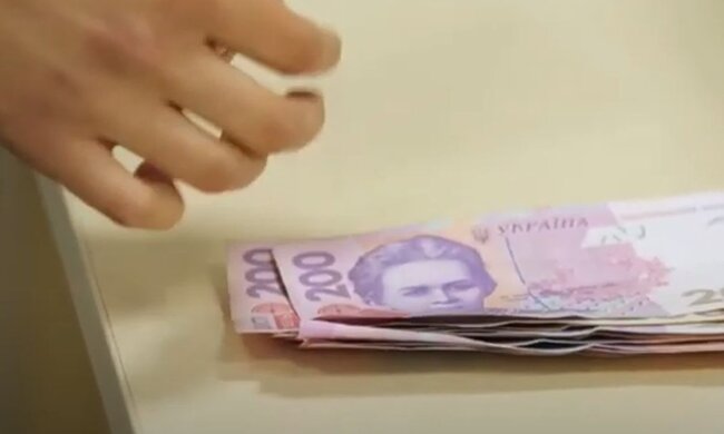 Деньги. Фото: скриншот YouTube-видео