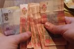 Деньги.  Фото: скриншот YouTube-видео