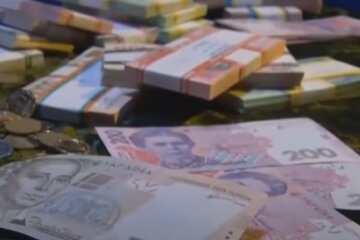 Деньги. Фото: скриншот Youtube-видео.