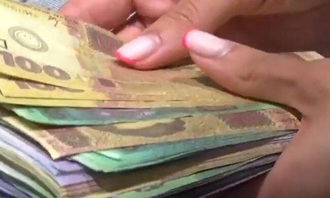 Деньги. Фото: скриншот YouTube-видео