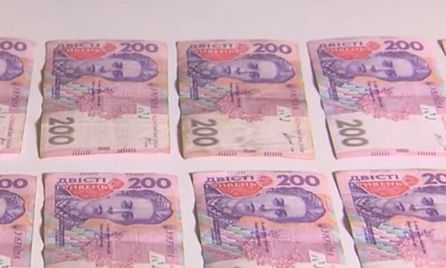 Деньги. Фото: скриншот YouTube-видео