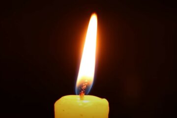Свеча памяти. Фото: скриншот YouTube