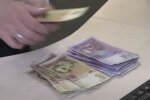 Деньги. Фото: скриншот YouTube-видео