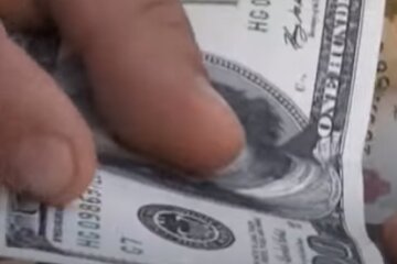 Доллары. Фото: скриншот YouTube-видео