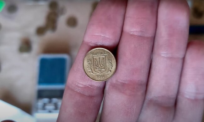 Монета. Фото: YouTube, скрін