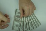Доллары. Фото: скриншот YouTube