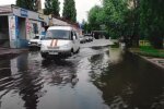 Днепр поплыл после ливня, повалило деревья и валится мост: кадры последствий стихии