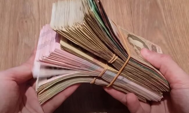 Деньги. Фото: скриншот YouTube-видео