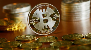 Биткоин. Фото: DW