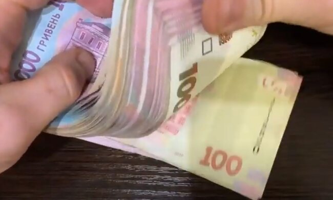 Деньги. Фото: скриншот YouTube-видео