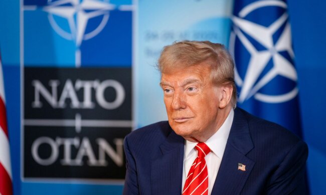 Флаги стран НАТО на саммите — США планируют сократить военное присутствие в Европе