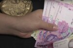 Деньги. Фото: скриншот YouTube-видео