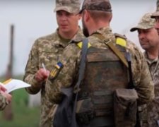 На Донбассе ранены три солдата. Фото: скриншот YouTube