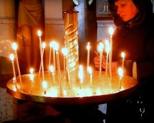 Свічки в церкві. Фото: скріншот YouTube-відео