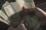 Деньги. Фото: скриншот YouTube-видео