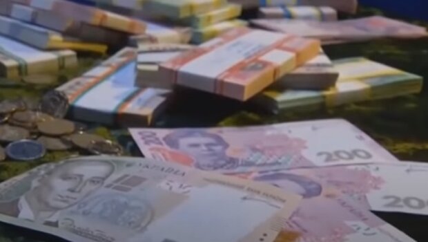 Деньги. Фото: скриншот Youtube-видео.