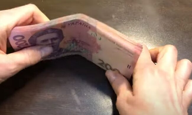 Деньги. Фото: скриншот YouTube-видео