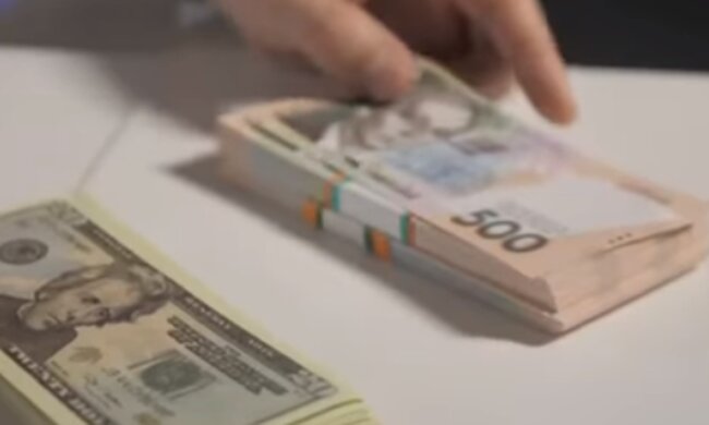 Деньги. Фото: скриншот YouTube-видео